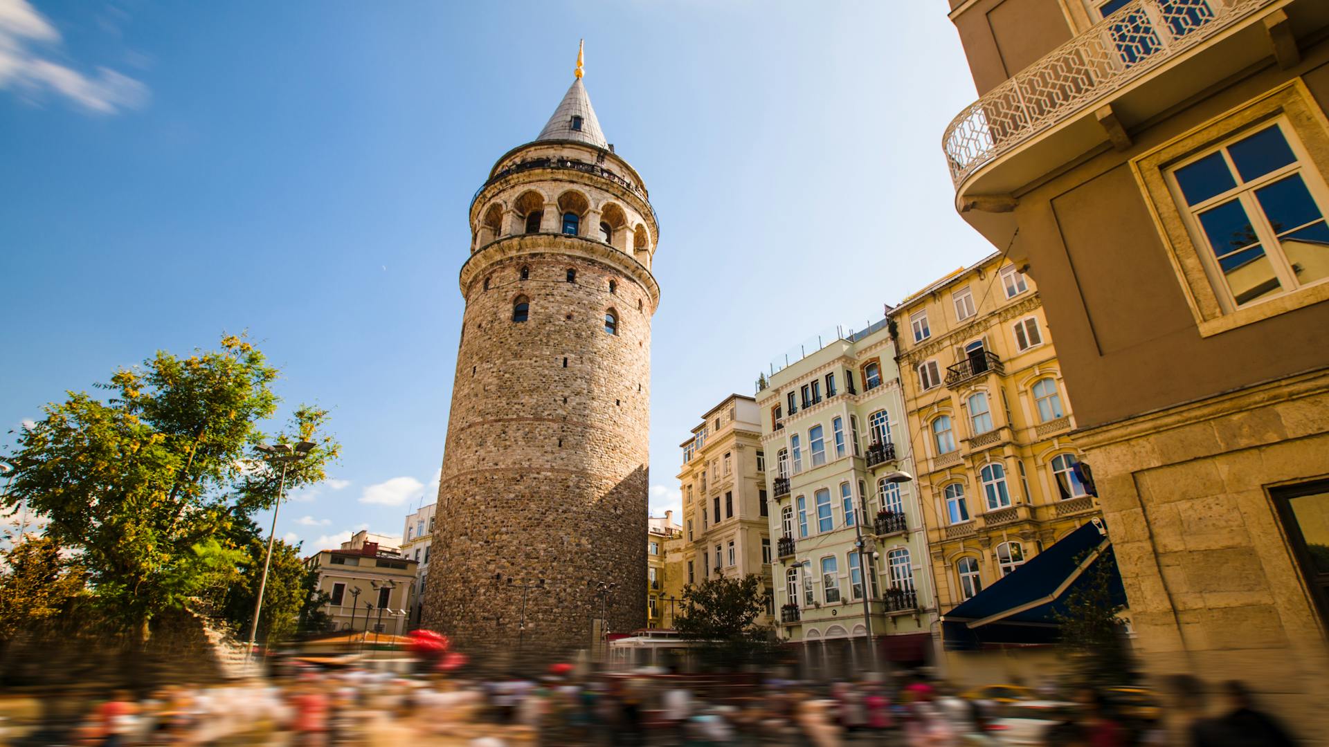 Galata Tower with lively street scene in Istanbul – Conmigo Travel Agency