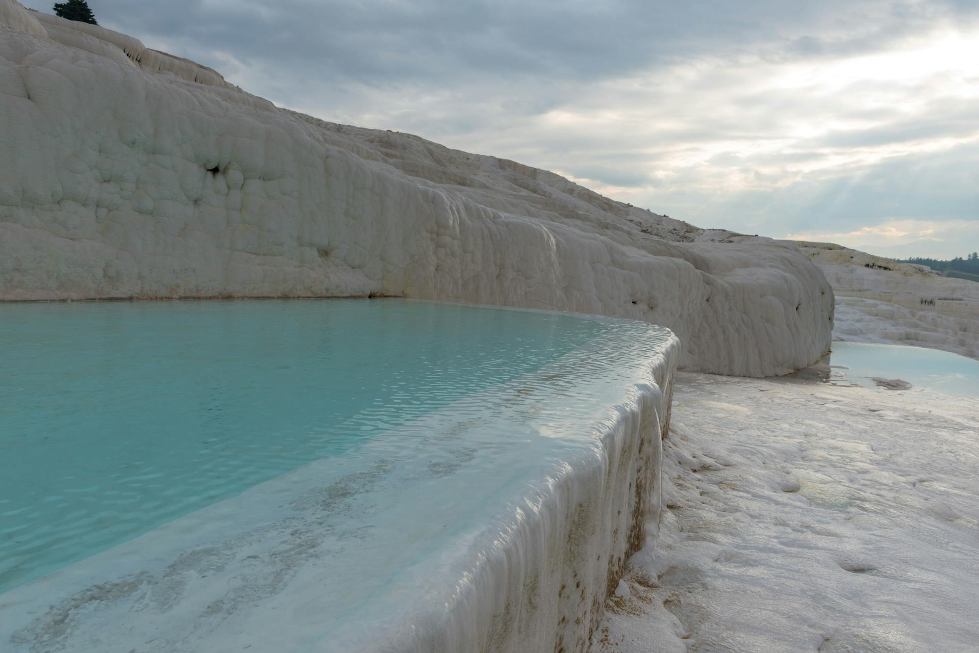 Natural thermal water pools at Pamukkale travertines, Turkey | Conmigo Travel Agency